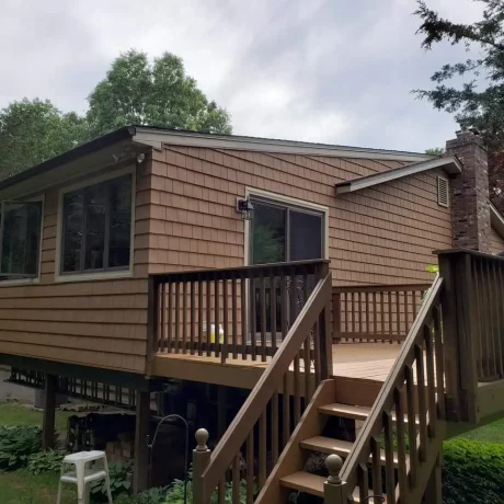 a house with a deck and stairs