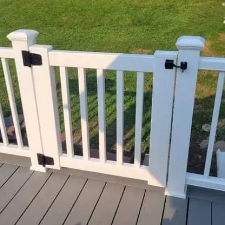 a white gate on a deck