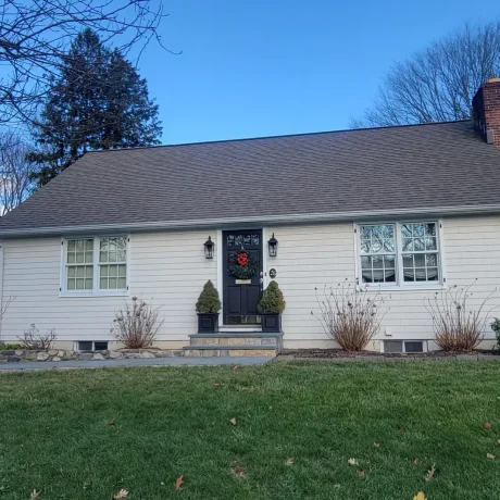 a house with a lawn and a door