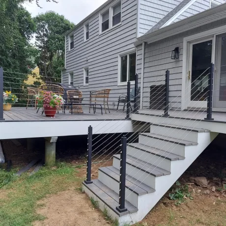 a deck with cable railing around it