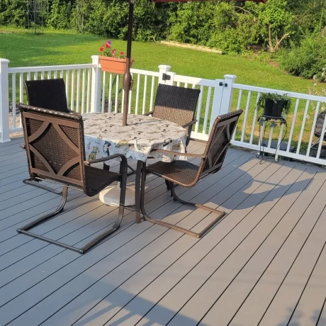 a table and chairs on a deck